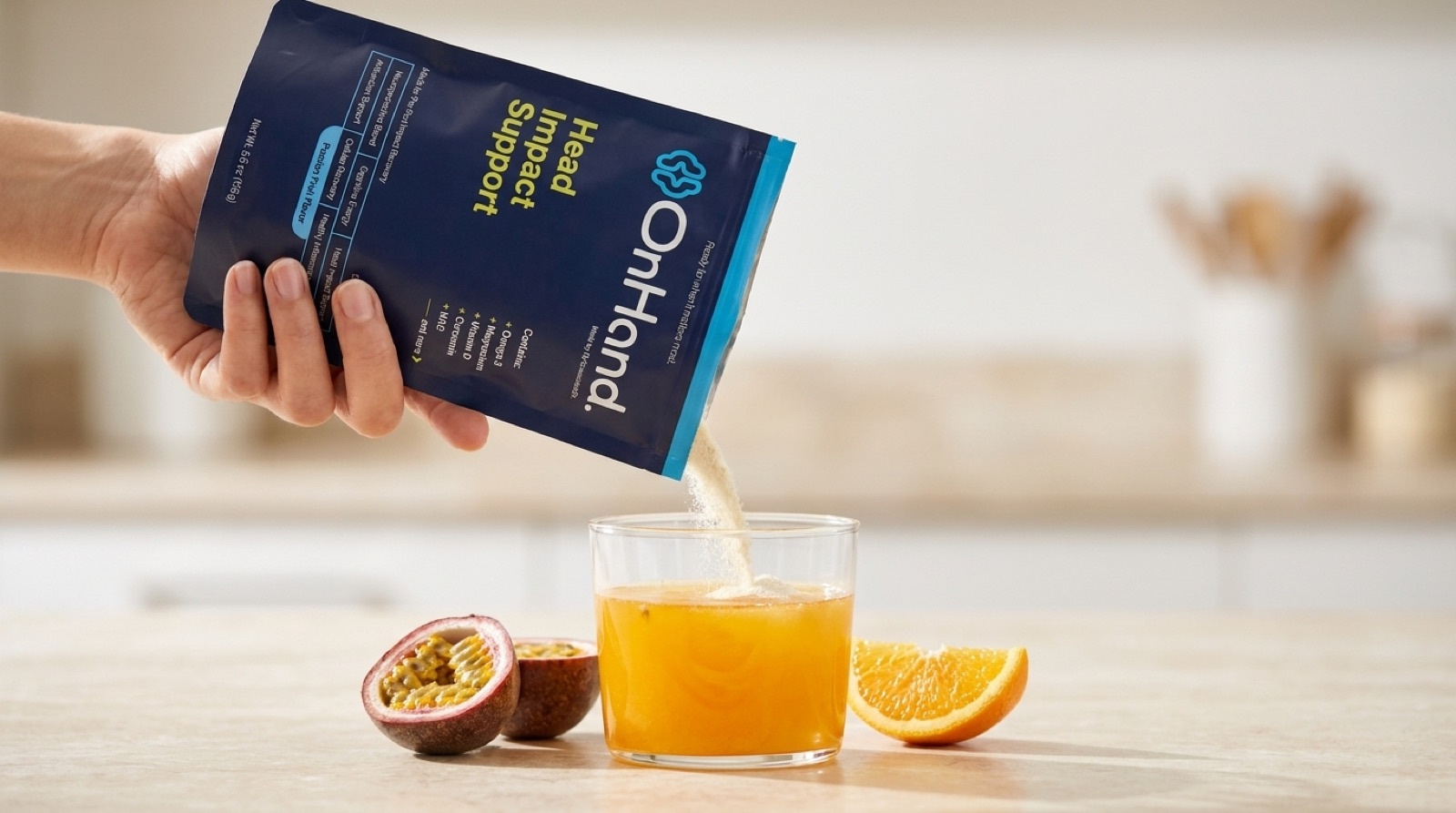 Pouring OnHand into a glass of orange passion-fruit drink